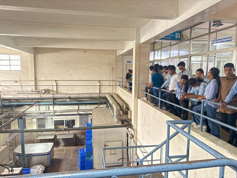 Students observing the functioning of Briquette Boiler